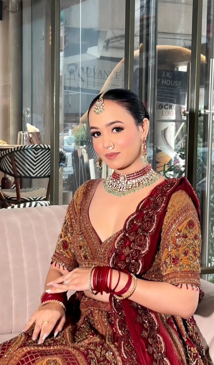 Bride with red dupatta and kundan jewellery, makeup by AARIA